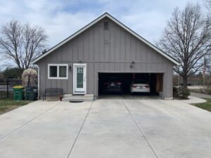 Before Exterior remodel on Overland Park home with khaki James Hardie Siding