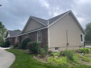 Exterior remodel on Overland Park home with khaki James Hardie Siding