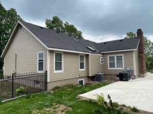 Exterior remodel on Overland Park home with khaki James Hardie Siding