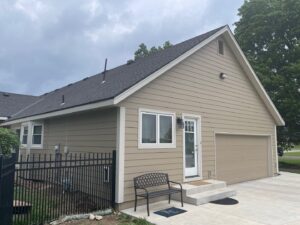 Exterior remodel on Overland Park home with khaki James Hardie Siding