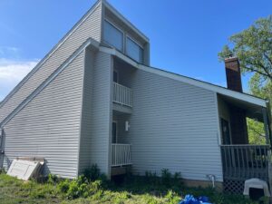 Before grey james hardie siding and provia window replacement on lee's summit home