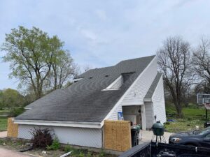 Before grey james hardie siding and provia window replacement on lee's summit home