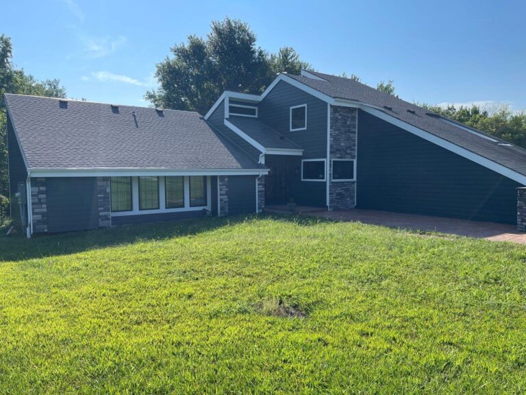 grey james hardie siding and provia window replacement on lee's summit home