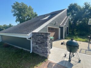 grey james hardie siding and provia window replacement on lee's summit home