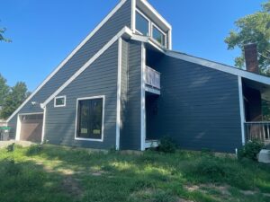 grey james hardie siding and provia window replacement on lee's summit home