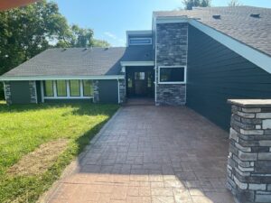 grey james hardie siding and provia window replacement on lee's summit home